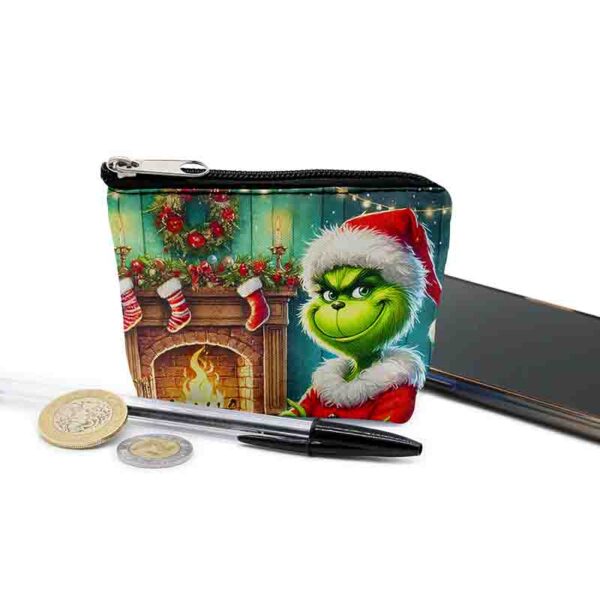 Grinch sonriendo Monederitos regalos de navidad animado MOD. Travesura junto al Fuego